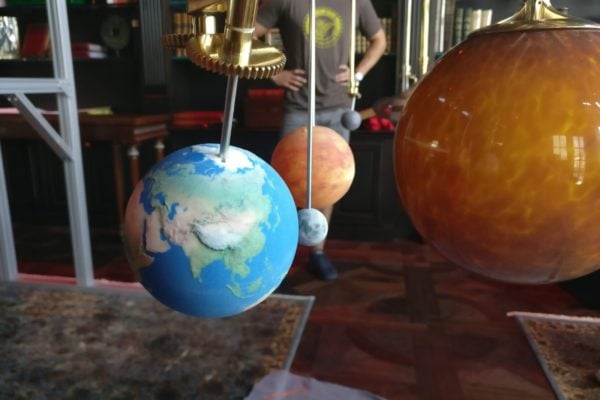 Close up of a 3D printed earth on Tycho Design's astronomical clock